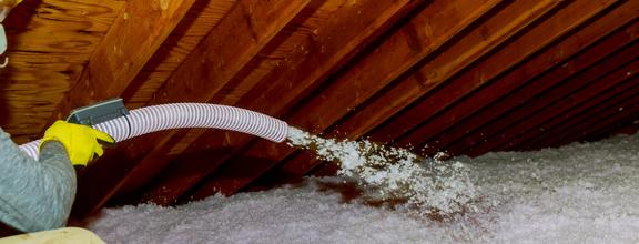 Technician spraying blown fiberglass insulation be 2026 01 09 09 31 10 utc